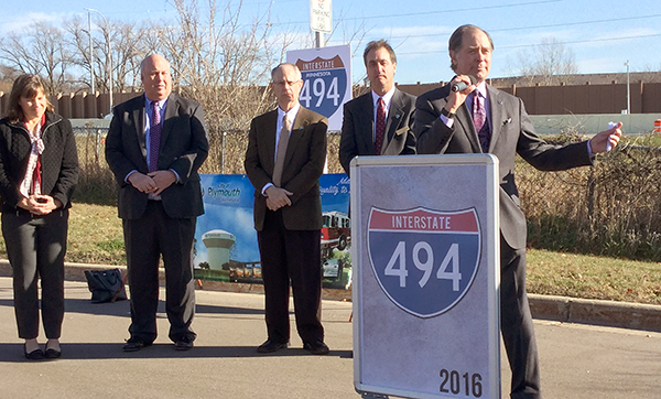 Photo of Commissioner Charlie Zelle speaking at I-494 ribbon cutting ceremony.